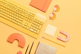Yellow and orange office equipment on a surface.