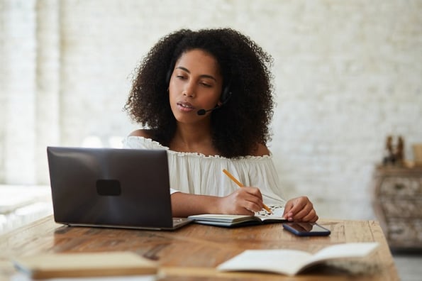 Image of woman studying Java and JavaScript programing languages.