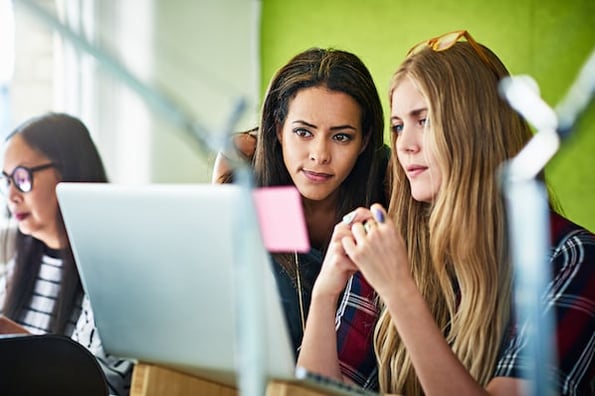 two data engineers viewing a materialized view
